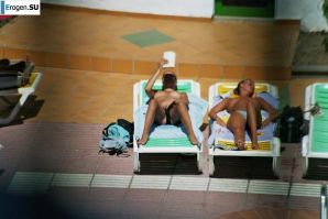 Girls sunbathe topless near the pool. Part 2. Thumb 16