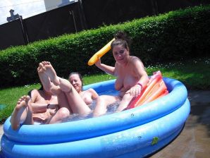 three girlfriends sunbathe in the yard with bare breasts. Part 2. Thumb 23