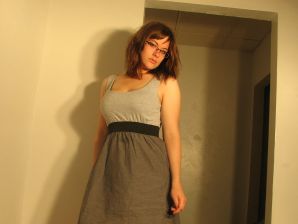 A girl with large breasts poses in clothes and then undresses. Thumb 12