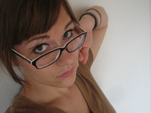A girl with large breasts poses in clothes and then undresses. Thumb 5