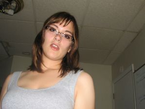 A girl with large breasts poses in clothes and then undresses. Thumb 7