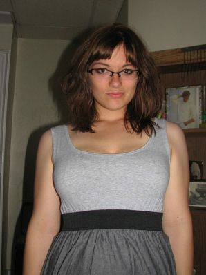A girl with large breasts poses in clothes and then undresses. Thumb 9