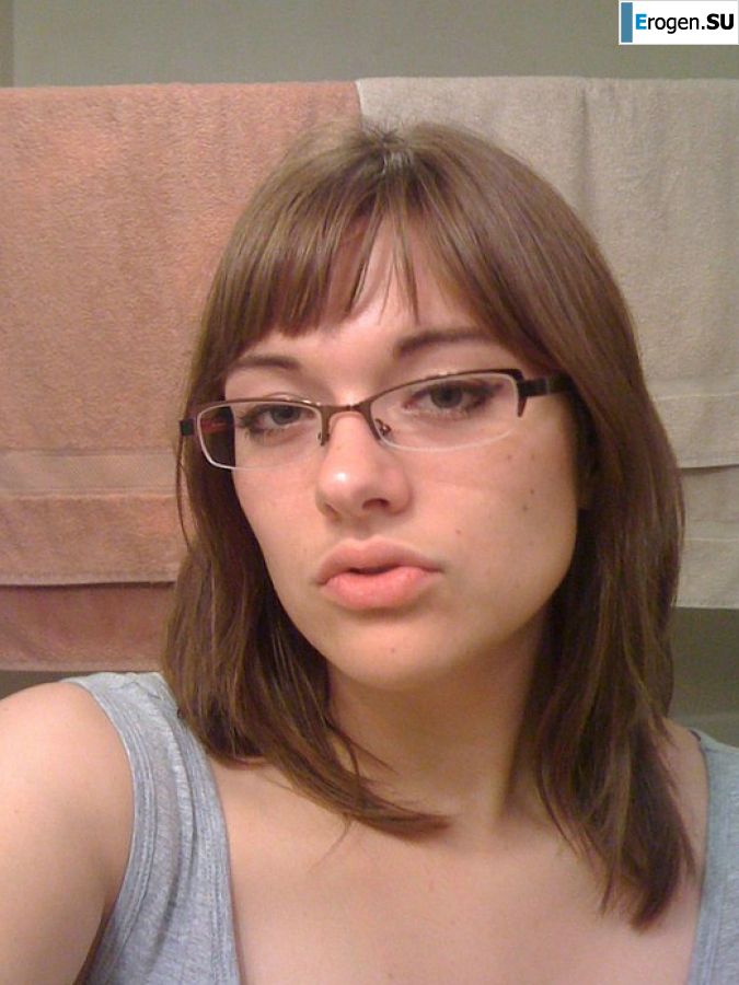 A girl with large breasts poses in clothes and then undresses. Part 2. Slide 1