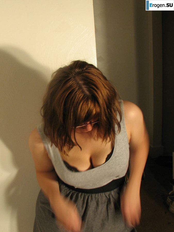 A girl with large breasts poses in clothes and then undresses. Part 2. Slide 25