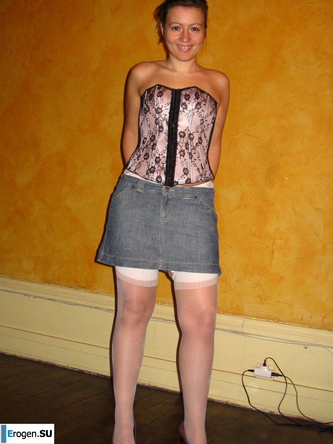 A young woman shows her ass and legs in white stockings. Slide 22
