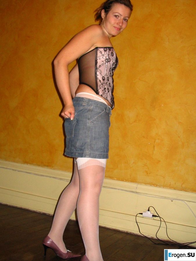 A young woman shows her ass and legs in white stockings. Slide 23