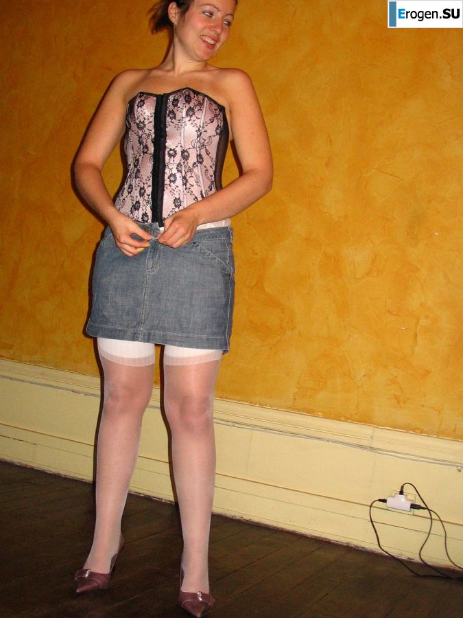A young woman shows her ass and legs in white stockings. Slide 24