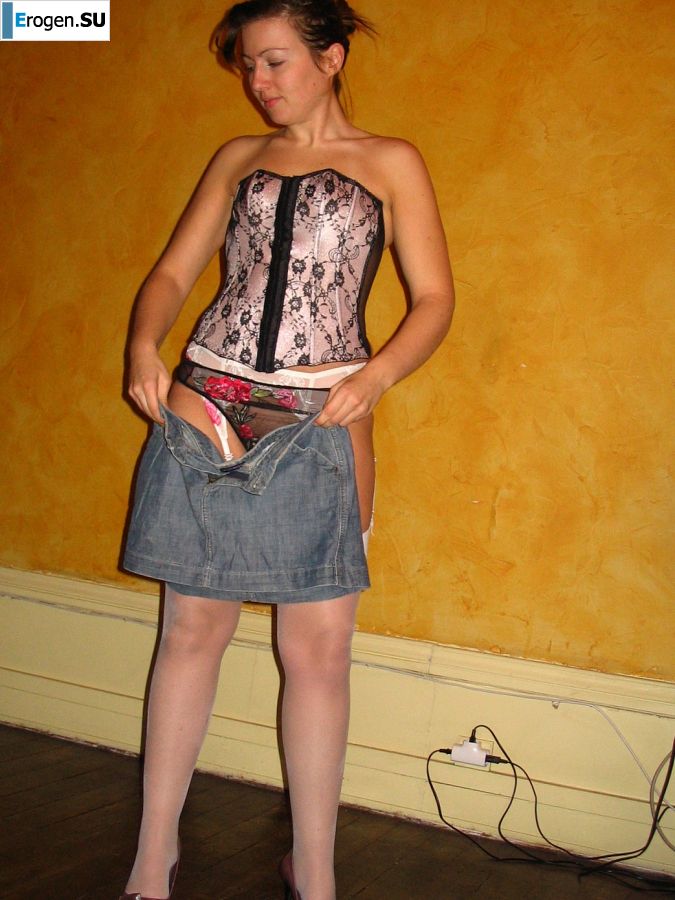 A young woman shows her ass and legs in white stockings. Slide 25