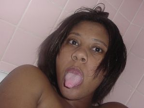 The mulatto pulls her boobs, and then spreads her legs. Thumb 40