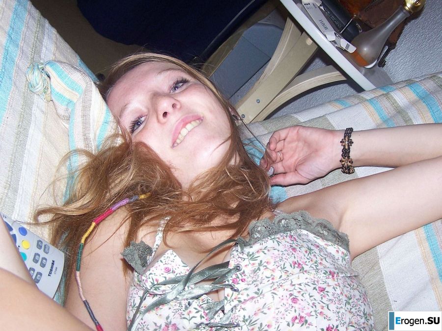 The red-haired beauty poses on the bed without panties, spread her legs. Slide 16