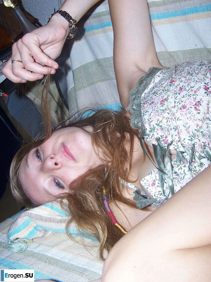 The red-haired beauty poses on the bed without panties, spread her legs. Slide 19