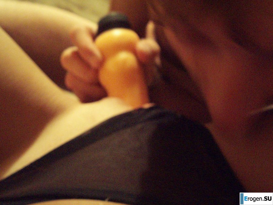 A woman caresses herself spreading her legs apart on the camera. Slide 34